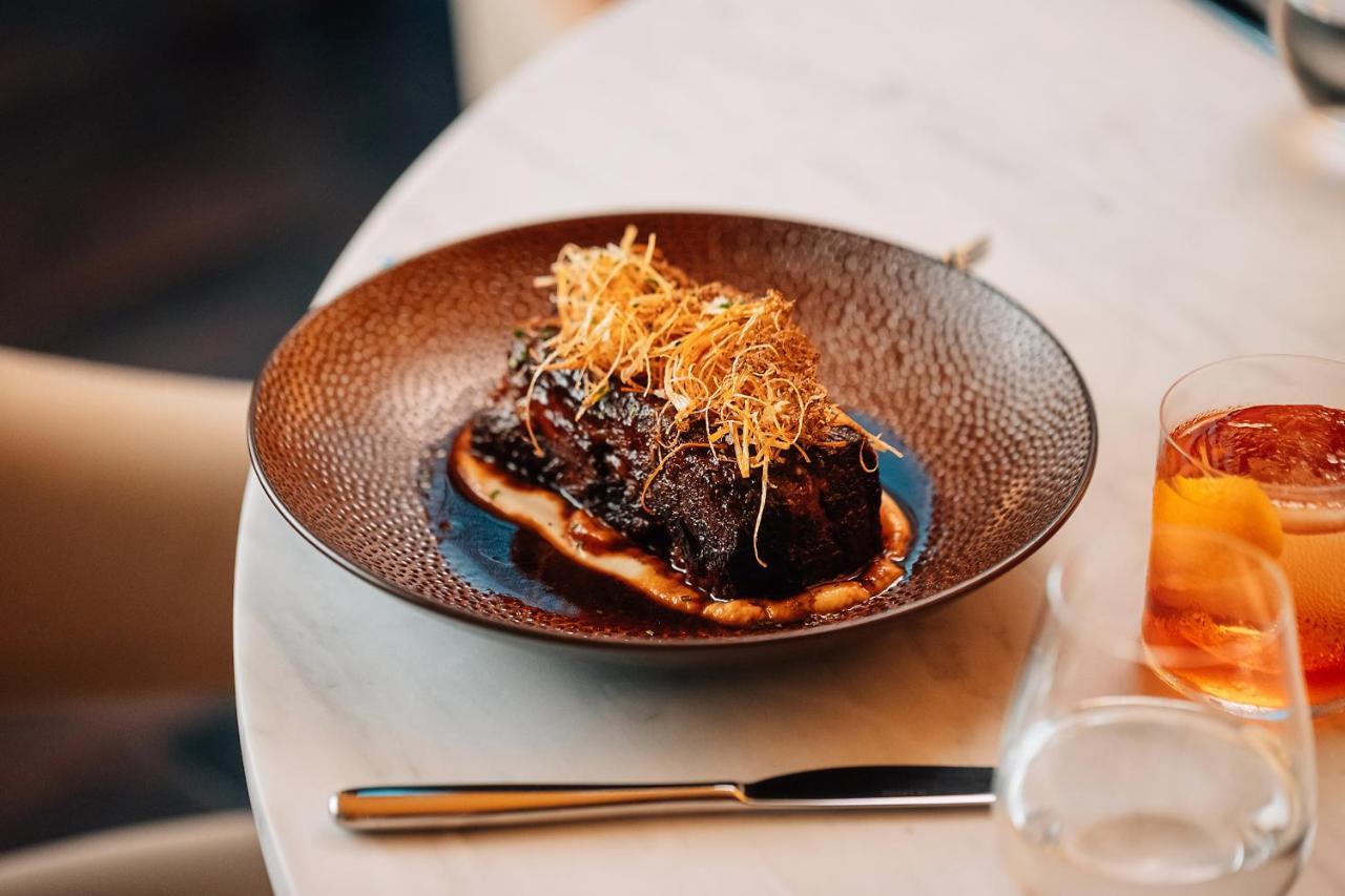 The Dubai Edition Экстерьер фото A dish at the restaurant